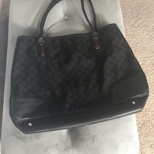 Authentic Gucci black leather and gold bag
